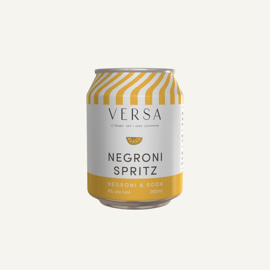 A can of Versa Negroni Spritz with a yellow and white label, indicating the flavor and brand.